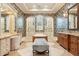 Elegant bathroom with a soaking tub, walk-in shower and a large vanity area at 1211 Aquila Loop, Kissimmee, FL 34747