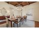 Dining area showcasing tray ceilings, chandelier, and a large window allowing for lots of natural light at 1211 Aquila Loop, Kissimmee, FL 34747