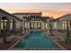 Relaxing backyard pool area featuring a covered pergola with stone pillars at 1211 Aquila Loop, Kissimmee, FL 34747