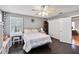 Comfortable bedroom featuring stylish dark wood floors, a vanity, and a ceiling fan at 1240 Beth Ln, St Cloud, FL 34772