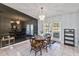 Elegant dining room featuring a charming chandelier, table setting and glass doors at 1240 Beth Ln, St Cloud, FL 34772