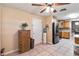 A room with neutral colors, a ceiling fan and view of the kitchen offers great options for a buyer at 1240 Beth Ln, St Cloud, FL 34772