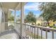 Balcony view overlooking a well-manicured street with lush greenery and charming neighborhood homes at 1343 Flagstone Ave, Celebration, FL 34747