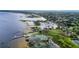 Aerial view of marina, pier, and lake offering a picturesque waterfront setting at 1422 Indiana Ave, St Cloud, FL 34769