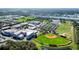 A panoramic aerial view showcasing community sports facilities, schools, and surrounding green spaces at 1422 Indiana Ave, St Cloud, FL 34769