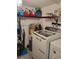 Functional laundry room featuring modern appliances, storage, and laundry essentials at 1422 Indiana Ave, St Cloud, FL 34769