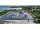 Wide aerial view of the marina offering many boat slips, waterfront restaurant, and parking area at 1422 Indiana Ave, St Cloud, FL 34769