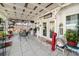 Outdoor patio with white pergola, seating, plants, and serene outdoor living space at 1422 Indiana Ave, St Cloud, FL 34769