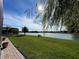 Beautiful backyard with a lush lawn and lake view, perfect for relaxing outdoors at 1820 Trophy Bass Way, Kissimmee, FL 34746