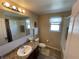 Neutral bathroom featuring granite counters, a large mirror, and a shower-tub combination at 1820 Trophy Bass Way, Kissimmee, FL 34746