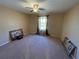 Spacious bedroom with a ceiling fan, carpeted flooring, and natural light at 1820 Trophy Bass Way, Kissimmee, FL 34746