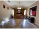 Dining area with tile floors, built-in hutch, chandelier and natural lighting at 1820 Trophy Bass Way, Kissimmee, FL 34746