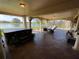 This large screened patio has a lake view, with plenty of room for seating and a hot tub at 1820 Trophy Bass Way, Kissimmee, FL 34746