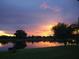 Picturesque sunset view over the pond reflecting vibrant colors across the water at 1820 Trophy Bass Way, Kissimmee, FL 34746