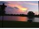 Beautiful sunset view reflecting off of the still pond at 1820 Trophy Bass Way, Kissimmee, FL 34746