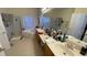 Large bathroom with a double vanity, soaking tub, and separate shower at 1966 Derby Glen Dr, Orlando, FL 32837