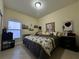 Inviting bedroom featuring a comfortable bed, window, and neutral decor, creating a relaxing atmosphere at 1966 Derby Glen Dr, Orlando, FL 32837