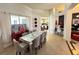 Elegant dining room with a modern table, stylish chairs, and an open layout, ideal for entertaining at 1966 Derby Glen Dr, Orlando, FL 32837