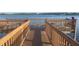 Wooden dock with railing extends into the lake, offering waterfront enjoyment at 1966 Derby Glen Dr, Orlando, FL 32837