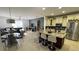 Open layout kitchen with granite countertops and stainless steel appliances flowing into the living room at 1966 Derby Glen Dr, Orlando, FL 32837