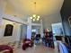 Open concept living space showing a desk area, dining room, kitchen, and decorative lighting at 1966 Derby Glen Dr, Orlando, FL 32837