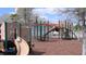 Community playground featuring slides, climbing structures, and a wood chip safety surface at 1966 Derby Glen Dr, Orlando, FL 32837
