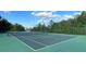 Outdoor tennis court with green surface, white lines, and surrounding green landscape at 1966 Derby Glen Dr, Orlando, FL 32837