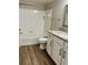 Bright bathroom showcasing granite vanity and shower-over-tub at 2212 Grand Cayman Ct # 1616, Kissimmee, FL 34741