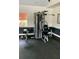 Community gym with a machine weight station and rubber flooring at 2212 Grand Cayman Ct # 1616, Kissimmee, FL 34741