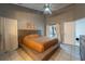 Inviting bedroom with tile flooring and a private backyard door at 233 River Chase Dr, Orlando, FL 32807