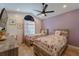 Bright bedroom with vaulted ceilings, decorative wall art, and matching twin beds at 233 River Chase Dr, Orlando, FL 32807