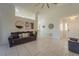 Spacious living area with lots of natural light and neutral tile flooring at 233 River Chase Dr, Orlando, FL 32807