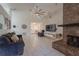 Bright living room with a vaulted ceiling, modern fireplace, and neutral colors at 233 River Chase Dr, Orlando, FL 32807