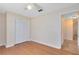 Bright bedroom featuring hardwood floors, closet and a bright window for plenty of natural light at 2408 Sweetwater Blvd, St Cloud, FL 34772