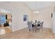 Dining room with neutral paint, tile floors, and an open view into an adjacent bedroom at 2408 Sweetwater Blvd, St Cloud, FL 34772