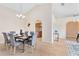 Dining room with neutral paint, tile floors, and a modern chandelier at 2408 Sweetwater Blvd, St Cloud, FL 34772