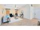 Vaulted ceiling in living room with neutral tones, stylish furnishings, and lots of natural light from the windows at 2408 Sweetwater Blvd, St Cloud, FL 34772