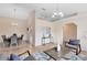 Open-concept living room and dining area with neutral paint, tile floors, and a chandelier at 2408 Sweetwater Blvd, St Cloud, FL 34772