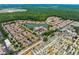 Lovely aerial view of community with lake, clubhouse and mobile home section at 2606 Roadster Ln, Kissimmee, FL 34746