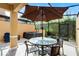 Enclosed patio with spa, seating under umbrella, perfect for relaxation and enjoying outdoors at 2606 Roadster Ln, Kissimmee, FL 34746