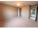 Bedroom with neutral carpet, closet with folding doors, and ceiling fan at 2801 Christy Ln, St Cloud, FL 34772