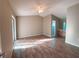 Large main bedroom with wood floors, ceiling fan, and sliding glass doors to an outdoor space at 2801 Christy Ln, St Cloud, FL 34772