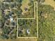 Aerial view of the property, showing boundaries and surrounding wooded areas, ideal for privacy at 2921 Seminole Rd, St Cloud, FL 34772