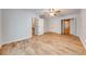 Bedroom featuring wood floor, ceiling fan, walk-in closet, and neutral walls at 2921 Seminole Rd, St Cloud, FL 34772