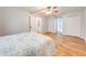 Spacious bedroom with a ceiling fan, wood floor, closet, and neutral walls at 2921 Seminole Rd, St Cloud, FL 34772