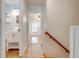 Hallway with wood floors connects the bathroom to the bedroom at 2921 Seminole Rd, St Cloud, FL 34772