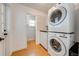 Convenient laundry room featuring a stackable washer and dryer at 2921 Seminole Rd, St Cloud, FL 34772