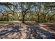 Large lot with mature trees and a two-story cottage style home at 2921 Seminole Rd, St Cloud, FL 34772