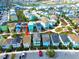 Aerial view showing colorful beach homes in a community near parking area at 2958 Salted Rim Rd, Kissimmee, FL 34747