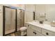 Modern bathroom with glass-enclosed shower and white vanity at 2958 Salted Rim Rd, Kissimmee, FL 34747